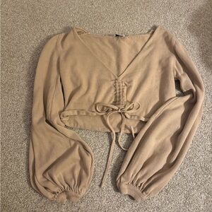 Tan, cropped Princess Polly sweater with adjustable tie front.